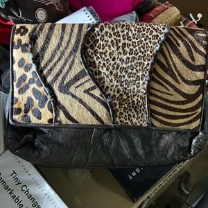 Beautiful leather clutch purse by Paul Joseph.  This item is PREOWNED - no tear